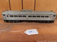 Side view of silver Lionel Baltimore and Ohio Budd car with roof ventilator and ‘400’ markings