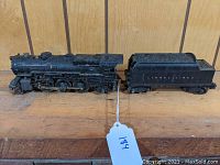 View of Lionel 2025 locomotive with tender set on wooden surface