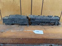 Side view of locomotive and tender showing overall condition and dust build-up