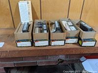 Five Roundhouse HO Train Equipment kits in original boxes, showing the contents and packaging.
