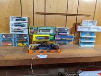 Shelf display showing multiple boxed N scale train items