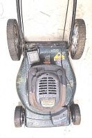 Top view of Craftsman lawn mower showing engine, wheels and overall condition with visible rust and wear.