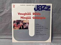 Front cover showing the title, artist names, and track listing of the vinyl album.