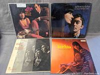Photo showing all four album covers arranged for display, featuring Ian & Sylvia in various poses.