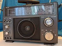 Front view of Venturer Model 2959 showing tuning meter, speaker, tuning and band controls, volume and tone knobs, power and AFC switches.