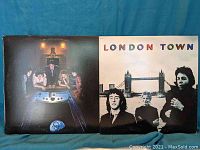 Front covers of two Wings vinyl record albums, 'Back to the Egg' and 'London Town', displayed side by side