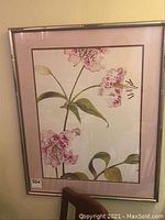 Full view of the framed print showing the floral still life art and frame details
