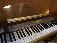 Close-up over the keyboard and control panel with LCD screen of the Suzuki SS-100 electric piano