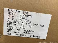 Label on large cardboard carton showing quantity as 2000 pcs, weight details, carton dimensions, and manufacturing info with batch number and manufacture date.