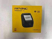 Yellow retail box of Rexing DashCam V1, highlighting 4K recording and Wi-Fi features.