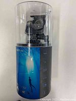 Vantop Moment 5C action camera displayed inside transparent plastic packaging with branding and waterproof depth rating.