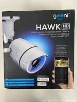 Front of sealed product box showing Geeni branding and camera image