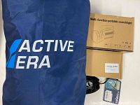 Blue Active Era carrying bag positioned next to packaged multifunction portable searchlight box