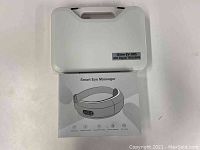 Closed carrying case labeled iStim EV-805 4CH Digital TENS/EMS with smart eye massager box underneath