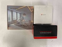 Three boxes: one for a 2-pack smart wall light switch KS602S, one Teckin brand box for smart sockets, and one red/black box for NZW30 in-wall smart switch.