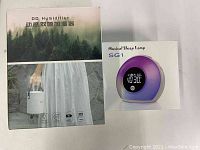 DD Humidifier and Musical Sleep Lamp SG1 original packaging boxes side by side.