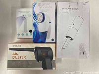 Four cleaning product boxes including OPOLAR air duster, handheld disinfection stick, lint remover, handheld vacuum cleaner show packaging and model images.