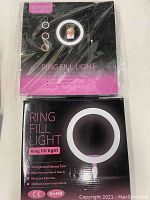 Front of the boxes showing 10 inch Dodocool ring fill light with branding and lighting features