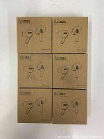 Front view of six Airmax wireless earphone boxes showing earbuds image.
