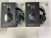 Front view showing two sealed Razer Nari Essential headset boxes side by side
