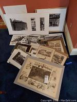 Overview of multiple matted and loose vintage black and white photos and prints showing historic buildings and scenes from Lehigh Valley, in varied sizes.