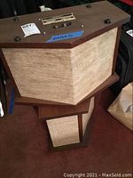 Pair of Bose 901 speakers stacked, showing wooden cabinet and fabric grille