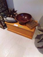 Wooden trunk with wood bowl, decorative duck, and box on top (items not included)