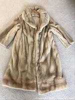 Full length image of vintage mink coat laid flat on carpet, showing front and overall condition.