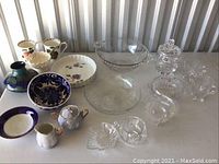 Overview of all pottery and crystal pieces arranged on a tabletop