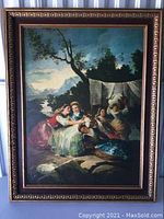 Full view of the framed painting showing a group of women with a sheep in a natural landscape with mountains and a river in the background.