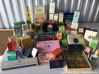 Overview of assorted perfume and soap boxes on table