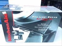 Box of KitchenAid Pro Line Series Burr Coffee Mill with product image and branding.