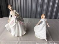 Two Royal Doulton porcelain figurines Carol and Friendship together on table