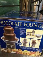 Box showing product branding and fountain photos