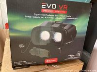 Front of EVO VR Pro Level 360 VR headset box showing logo, image of headset, and Bluetooth branding.