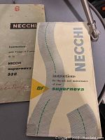 Instruction manuals for Necchi sewing machines with different model numbers visible including Supernova and 530 models.