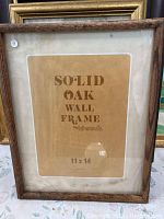 Solid oak wall frame by Intercraft with paper insert labeled 'Solid Oak Wall Frame 11x14'.