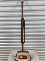 Full view of the Sunbeam floor conditioner showing the handle and base unit.