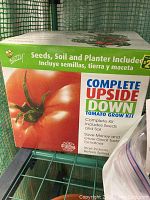 Box of Complete Upside Down Tomato Grow Kit showing included seeds, soil, and planter for growing tomatoes upside down indoors.