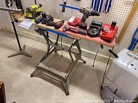 Overall view of workbench top with drills and chargers