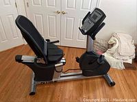 Side view showing seat, mesh backrest, and frame