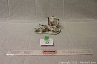 Full view of the 6 piece mini tea set displayed with ruler for scale showing size and arrangement of pieces.