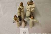 Group photo showing all five Willowtree figurines including mother and son, couple together, angel, happiness with arms outstretched and birds, and thank you figurine