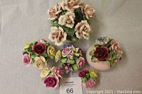 Overview photo showing all six fine china floral bouquets arranged in a grouping on a white surface.