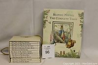 Front view of The Complete Tales book and the Peter Rabbit box set with 12 small books.