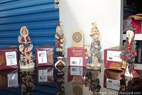 Photo showing four Boyds Bears and Friends figurines side by side on a reflective surface with their original maroon boxes in the background