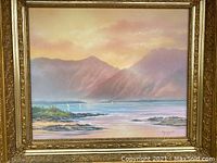 Full view of the framed original Earl Shimokawa oil painting depicting coastal landscape with mountains and sailboats at sunset.
