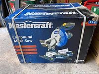 Closed box packaging showing Mastercraft brand and image of compound mitre saw.