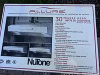 Photo of Allure NuTone 30 inch almond range hood box showing product image and features.