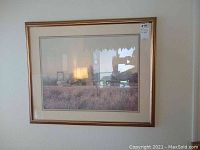 Large framed barn print signed by Gene Speck with visible matting and frame on wall.